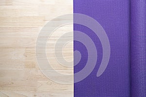 Close up of purple yoga mat on the table