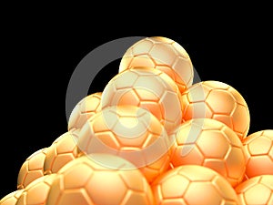 Close up of a pyramid made out of golden soccer balls