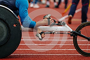 close-up racing wheelchair with male athlete