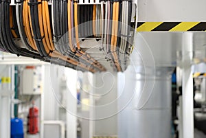 Close Up rack of power and network cables tied together in straight row