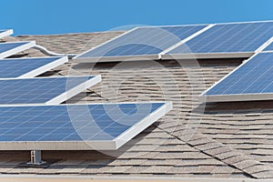 Solar panel installation on asphalt shingles rooftop