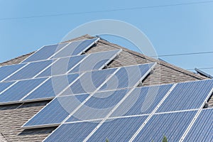 Solar panel installation on asphalt shingles rooftop