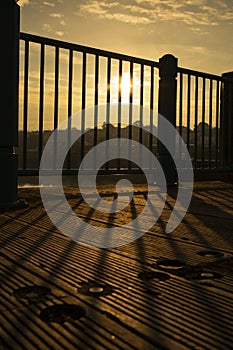 Close-up of railings on Caernarfon Pier, in Victoria Dock Wales, at sunrise