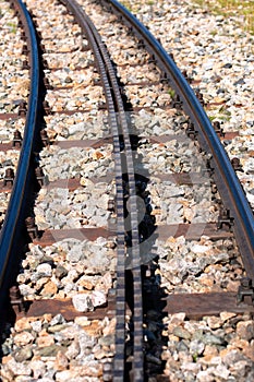 Close-up of a railroad track with a rack