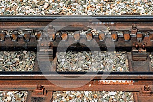 Close-up of a railroad track with a rack