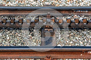 Close-up of a railroad track with a rack