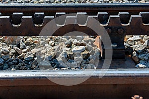 Close-up of a railroad track with a rack