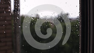 Close up rain drops on window pane