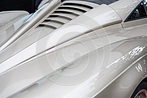 Close up of rare luxury car body with unique recognizable design. Italian automotive production presenting new