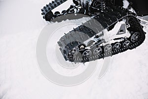 Close up on ratrak wheels on the snow