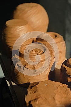 Close-up raw clay pottery chawan tea bowls drying in the sun