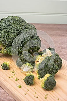 Close-up of raw, fresh broccoli BrÃÂ©col, brÃÂ³colli, brÃÂ³qui, broccoli brote, brassica oleracea stalks with drops of water in the photo