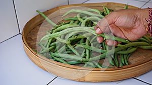 Close up of raw green beans in a basket