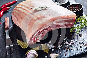 Close-up of raw pork belly with skin