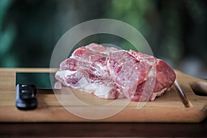 Close up raw pork on cutting board