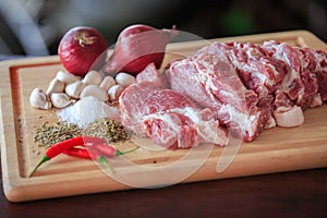 Close up raw pork on cutting board