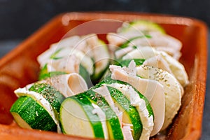 Close up of a raw zucchini with turkey ham