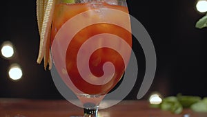 Close up ready-made bloody mary cocktail. Motion control system. Time remapping