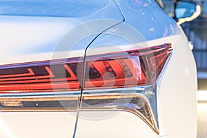 Close-up of rear light of modern white car