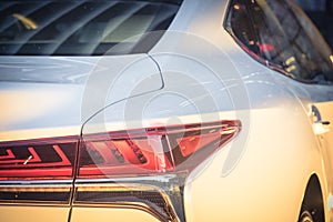 Close-up of rear light of modern white car