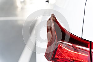 Close-up of the rear lights of the white SUV