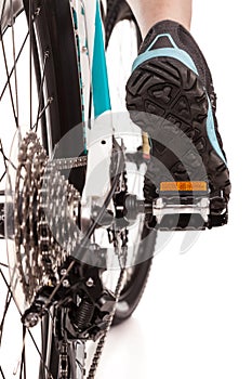 Close up rear view cyclist pedalling mountain bike