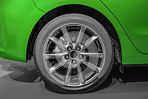 Close up rear wheel right of a Green car, Rear Wheel Driv