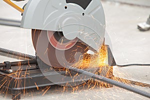 Close up of rebar being cut at a construction site. Short trail