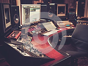 Close-up of recording studio control desk.