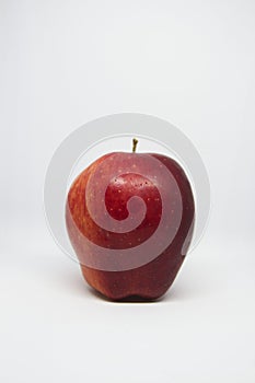 Close-up of red apple on white background