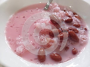 close up red bean ice with strawberry syrup