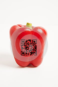 Close-up of red bell pepper with bar code over white background