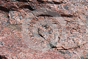 Close up of a red and black Feldspar, Quartz and Granite mixed rock