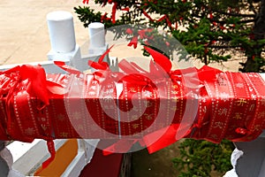 Close-up of red blessing ribbon in Medicine Buddha old temple in Jingpo lake geopark