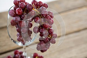 Close-up of red bunch of grapes in wine glass