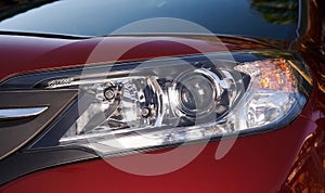 Close up of red car headlight