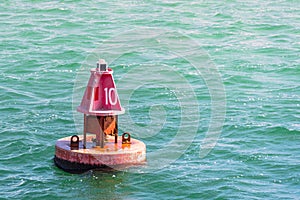 Close up of a red channel marker buoy