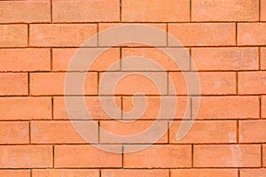 Close-up red clean brick wall used for background