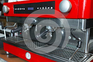 Close-up of red coffee machine in restaurant.