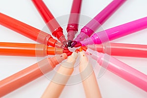 Close up of red colored felt-tip pens on isolated background. Selective focus