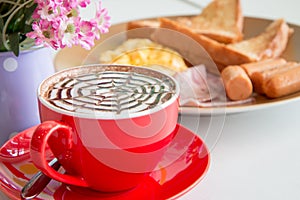 Close up red cup of coffee and breadfast