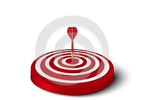 Close up of red dart hit to center of red dartboard on the floor. Arrow on bullseye in target. Business success, investment goal,