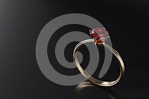 Close up red diamond ring isolated on dark background.
