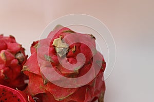 a close up of red dragon fruit isolated on white background.