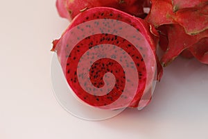 a close up of red dragon fruit isolated on white background.