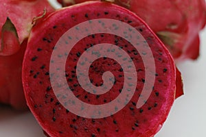 a close up of red dragon fruit isolated on white background