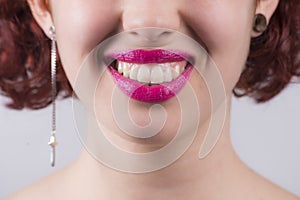 Close up of red glossy female lips smiling