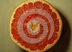 Close-up of a red grapefruit cut in half