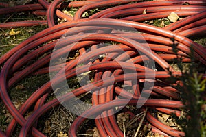 close up red irrigation hose photo