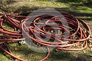 close up red irrigation hose photo